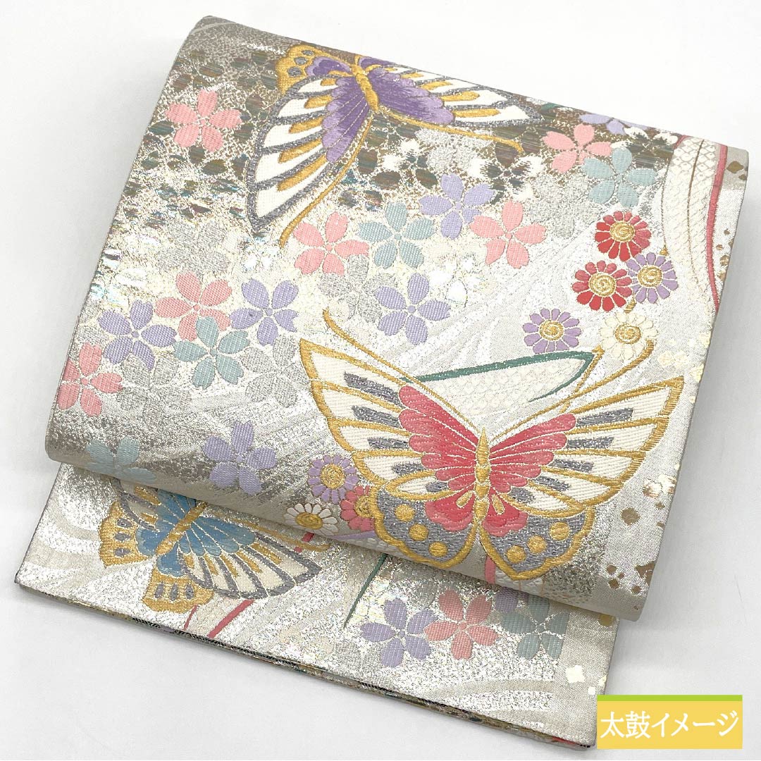 Formal, silver-colored, pure silk obi with a butterfly and cherry blossom pattern, perfect for furisode (long-sleeved kimono). Length: 436cm. Includes six obi stripes. Product code: 1123015552322.