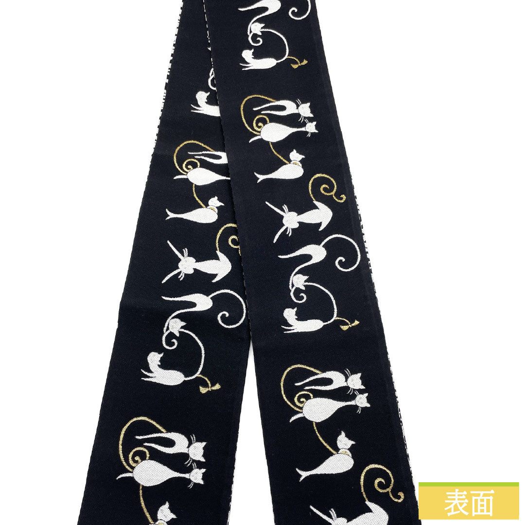 (Brand new, unused) Half-width Obi (sash) in pure silk, black, featuring a cat, abstract zebra, and other patterns. Reversible, full-length, 458cm long. Product code: 1125002271410