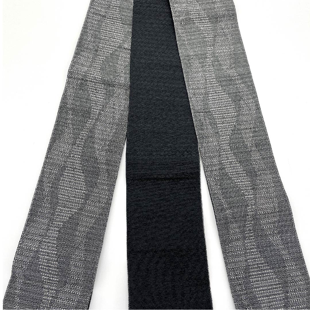 Kaku-obi (sash) made of polyester in ink-colored (guzumi-iro) with a flowing water pattern. Unused. Length 398cm, width 10.5cm. New rank. Gray. 1134000111922