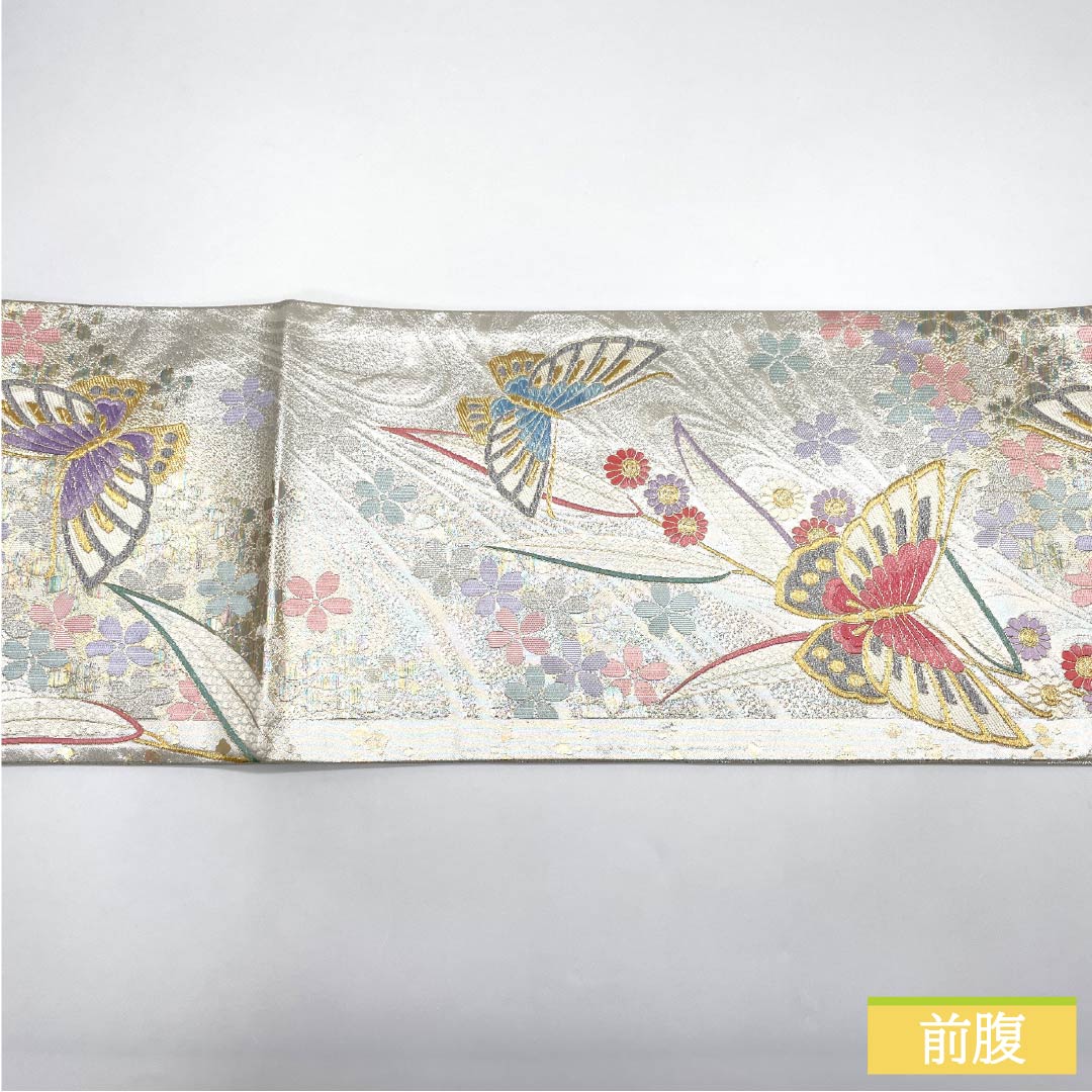 Formal, silver-colored, pure silk obi with a butterfly and cherry blossom pattern, perfect for furisode (long-sleeved kimono). Length: 436cm. Includes six obi stripes. Product code: 1123015552322.