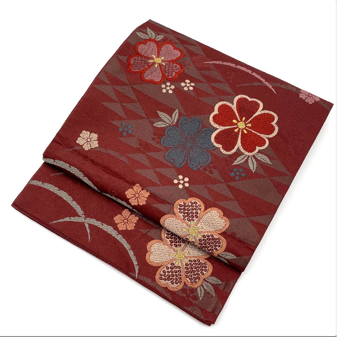 名古屋帯 京袋帯 深緋色 芝草 桜 鱗 唐草 帯丈381cm ポリ Sランク 六通 セミフォーマル 朱系 1124003322316  開き仕立て