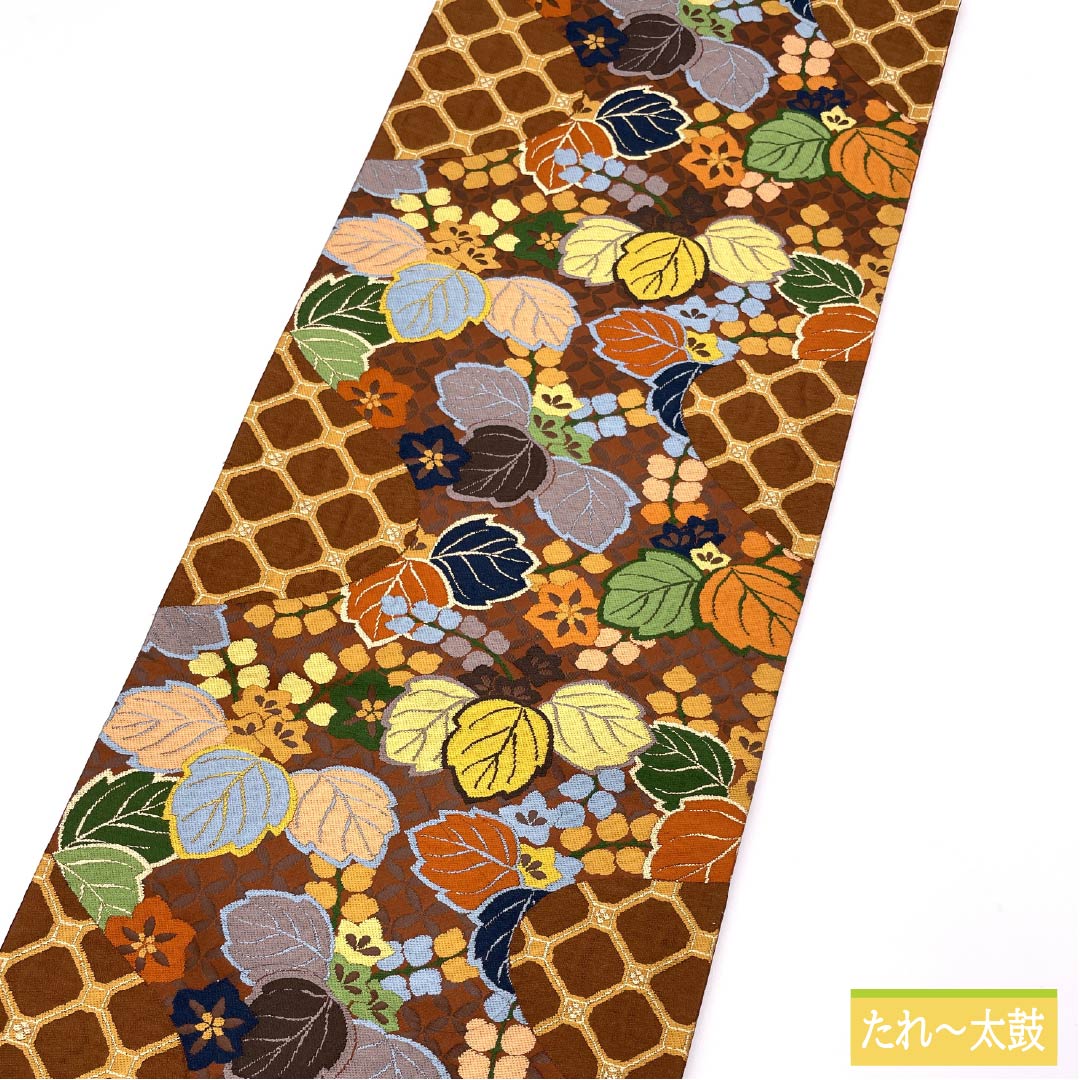 Brownish-brown silk obi for formal wear, suitable for furisode (long-sleeved kimono). Made by Shirayaen Oba and featuring paulownia wood. Length: 434cm. S-rank. Six-fold weave. Brown. Product code: 1123014422314