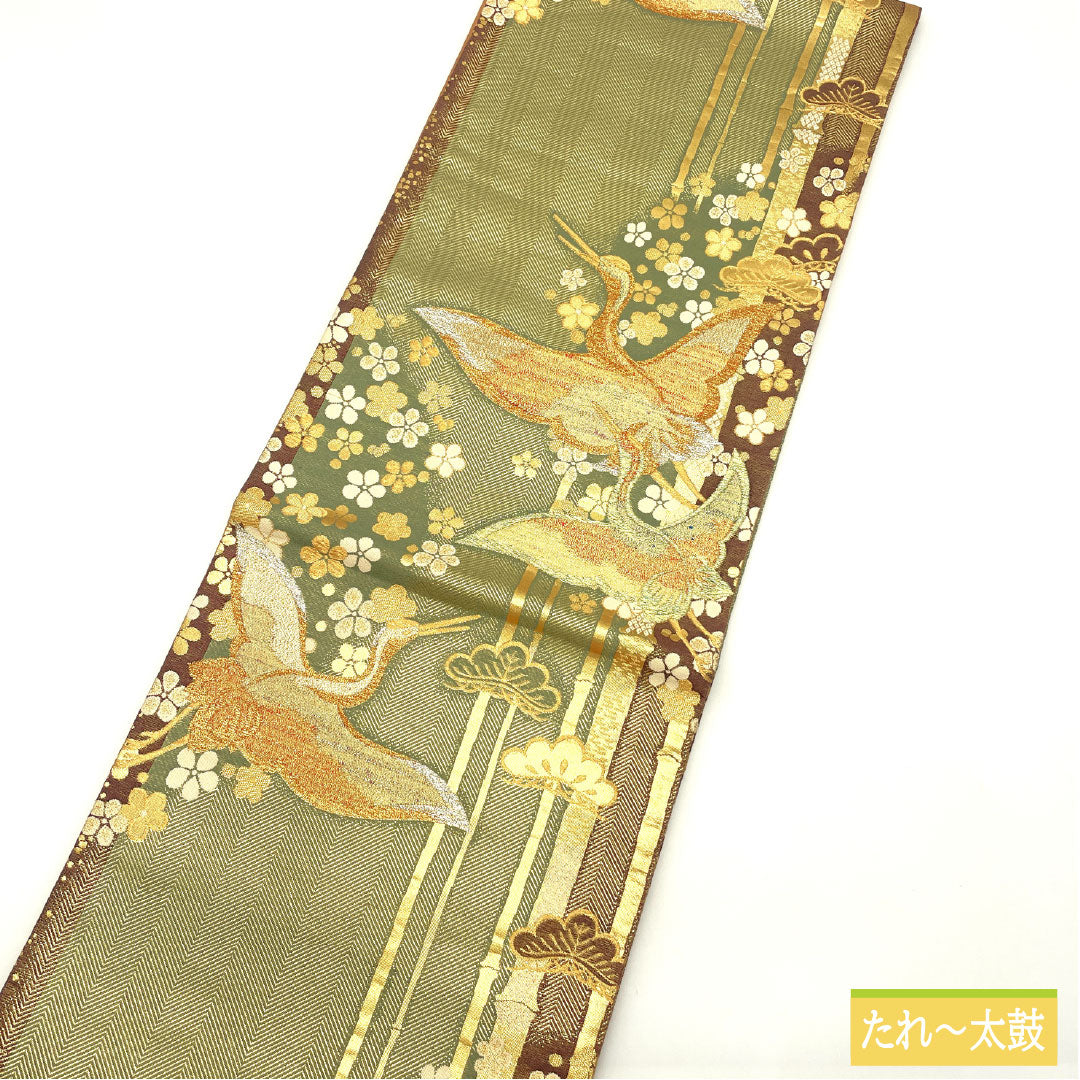 Formal, green-toned, pure silk obi with a crane design, bamboo, and plum motifs, suitable for furisode (long-sleeved kimono). Length: 436cm. Product code: 1123016502319.