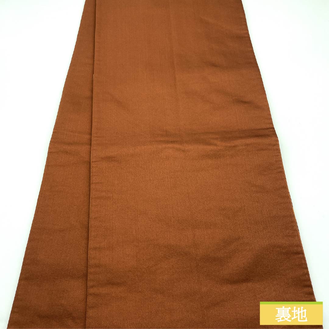 Brownish-brown silk obi for formal wear, suitable for furisode (long-sleeved kimono). Made by Shirayaen Oba and featuring paulownia wood. Length: 434cm. S-rank. Six-fold weave. Brown. Product code: 1123014422314